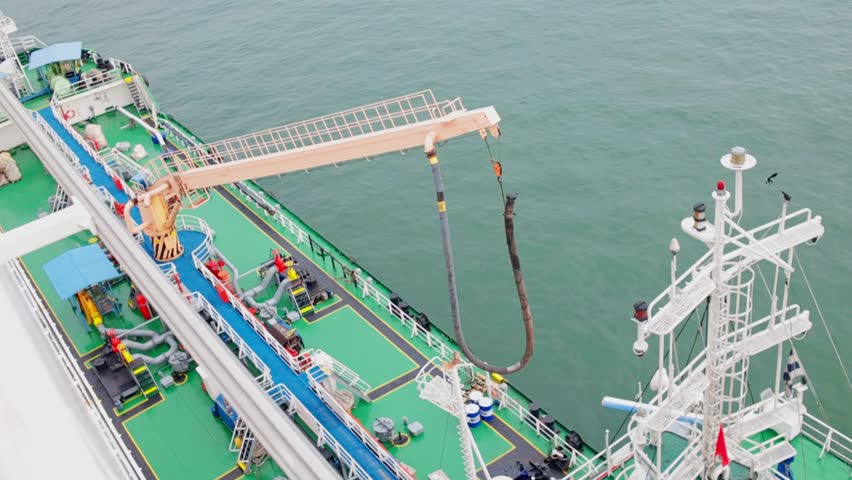 Top View Of Small Fuel Tanker Loading A Cruise Ship With Fuel