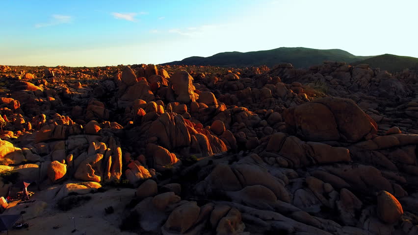 Aerial: Drone Forward Shot Of Rugged Rocks In Joshua Tree National Park On Sunny Day