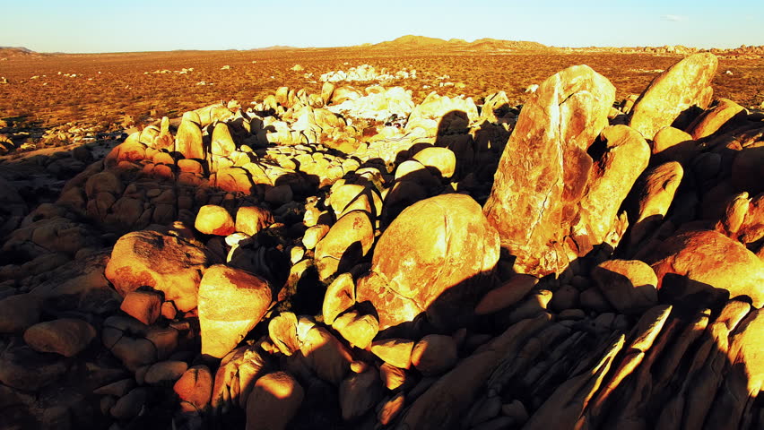Aerial Forward Shot Of People With Cars In Semi Arid National Park Against Clear Sky - Joshua Tree, California