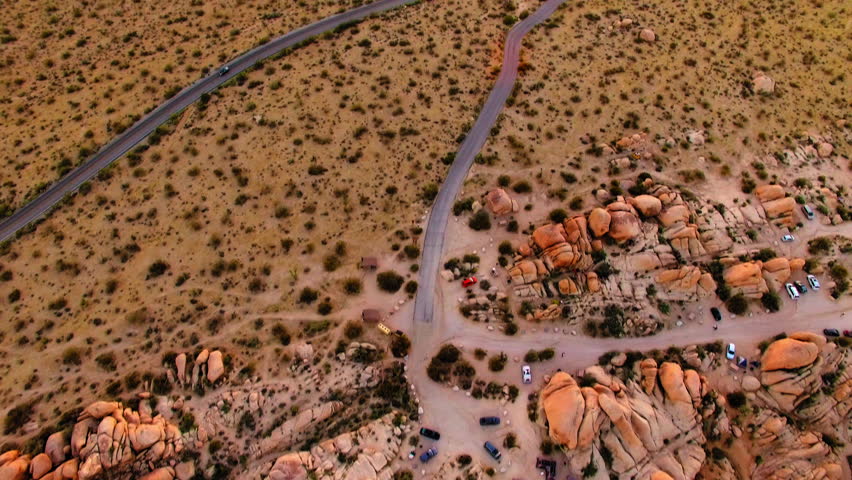 Aerial Forward Tilt Up Scenic Shot Of Semi Arid National Park During Tranquil Sunset - Joshua Tree, California
