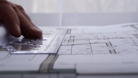 The designer draws with a compass and ruler on the drawing - Powered by Shutterstock - Get 15% off with code: PIKWIZARD15