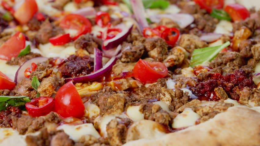 Cutting a pizza close up from the side