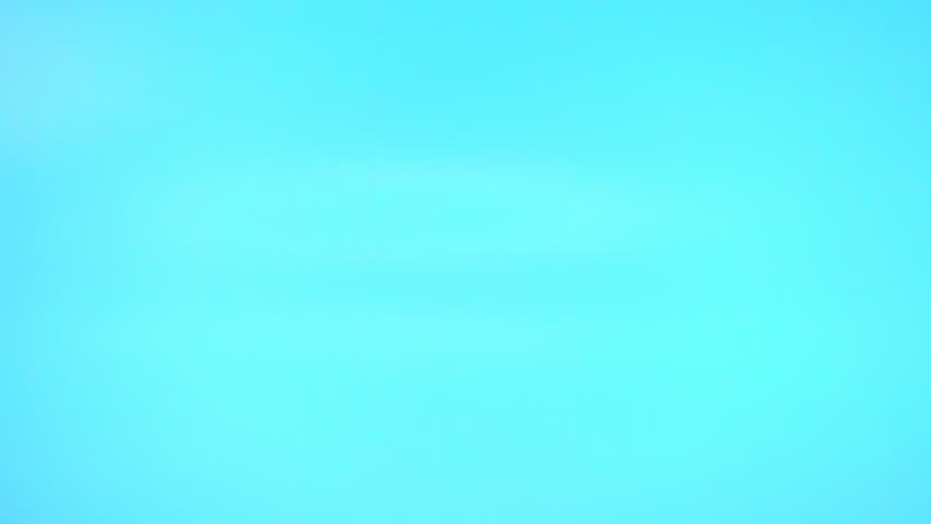 colorful sprinkles falling on blue background, decoration for cake and bakery, slow motion