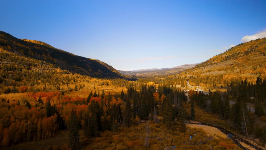 Colorful fall foliage on mountain slopes in Uinta Wasatch Cache National Forest, Utah