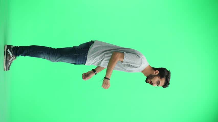 A man, on a green background, in full height - Powered by Shutterstock - Get 15% off with code: PIKWIZARD15