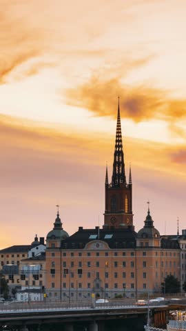 Stockholm, Sweden. Scenic View Of Stockholm Skyline At Summer Evening. Day To Night Transition Time Lapse. Famous Popular Destination Scenic Place In Sunset Lights. Riddarholm Church, Subway Railway.