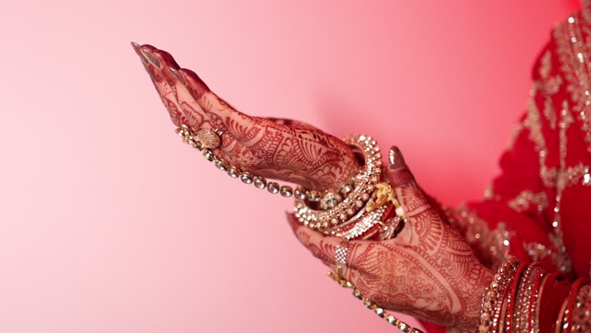 indian hindu bride with mehandi artwork on hands