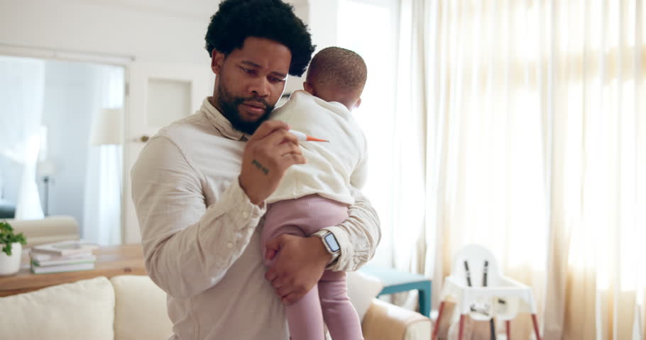 Thermometer, baby and fever with father in lounge, sick or medical help for child in home living room. Illness, cold and temperature check for newborn, male person or dad with worry for healthcare