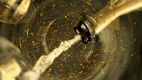 Super Slow Motion of Pouring Champagne Wine into Glass with Glittering Particles. Unique Perspective of View from Glass Bottom. Filmed on High Speed Cinema Camera, 1000 fps. - Powered by Shutterstock - Get 15% off with code: PIKWIZARD15