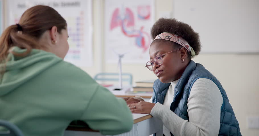 Teacher, woman and girl for consulting at high school with advice, results or check for progress. Mentor, people and student with smile for help, study or learning for project in classroom at academy