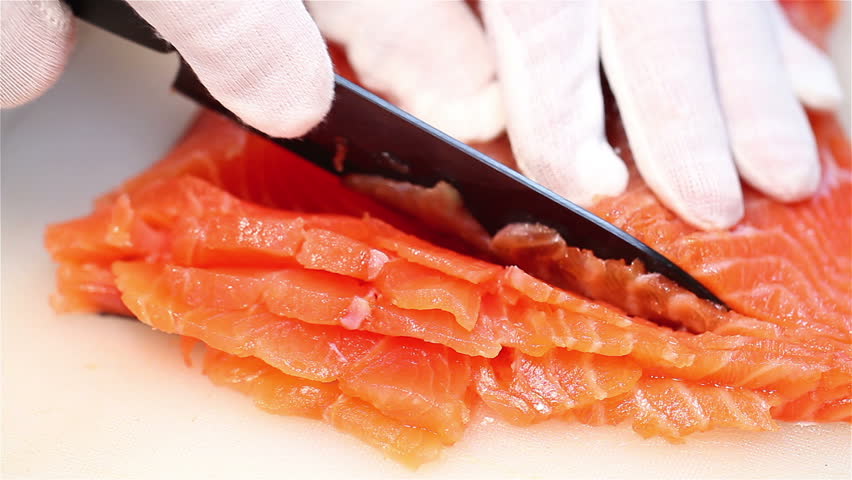 Slicing salmon fillets