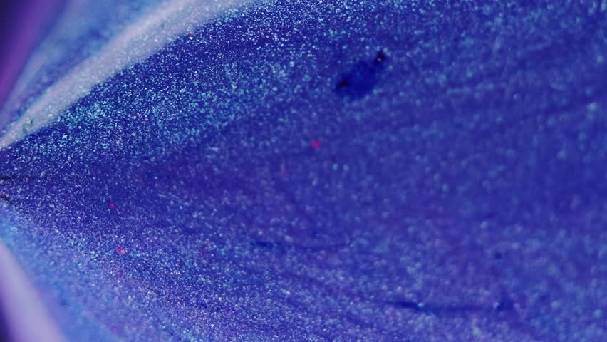 Glitter ink flow. Bokeh light. Blur neon blue purple color shimmering texture paint drip cascade triangle pyramid abstract art background.