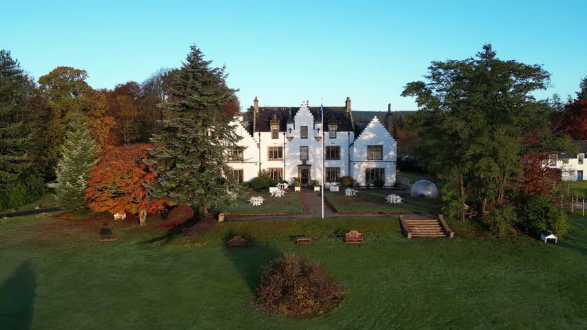 castle hotel fairytale early morning sunshine autumn estate luxury backward aerial