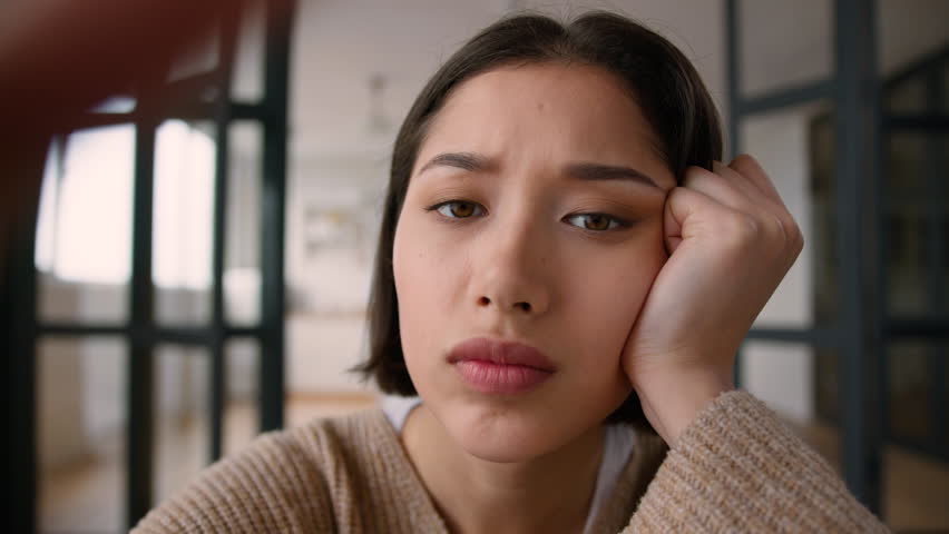 Point of view POV webcam tired bored girl hispanic latin woman addict using mobile phone touch screen smartphone addiction overuse social media scrolling browsing internet boring lazy female rest home