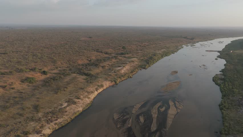 Spinning aerial of Crocodile River in Kruger National Park moments after sunrise.