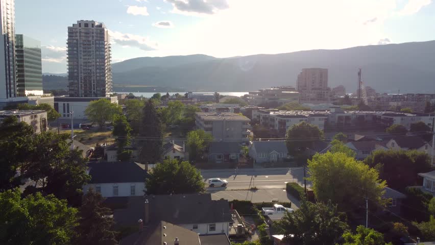 City of Kelowna, British Columbia, Canada. Downtown Waterfront Overlooking Okanagan Lake on a Beautiful Summer Day. Panorama views of Knox Mountain, Glenmore, and downtown residential neighbourhoods.