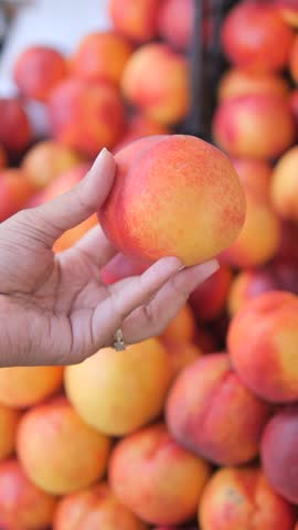 Fresh, ripe nectarines available at the farmers market, perfect for a healthy snack