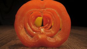 Red and yellow bell peppers on a wooden table. The camera moves through the pepper cut into rings. - Powered by Shutterstock - Get 15% off with code: PIKWIZARD15