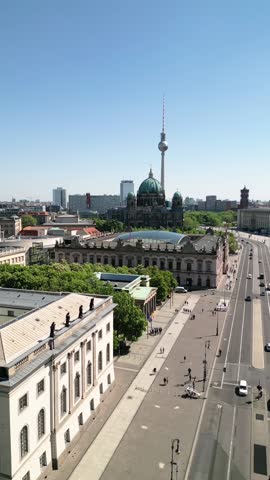 Aerial video of the streets of Berlin with a TV tower and a Berlin Cathedral in the background, Germany