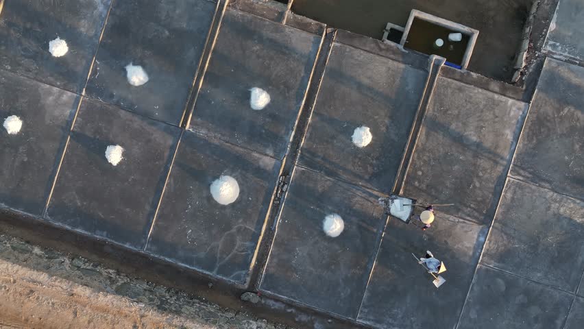 Salt fields during the period of preparing sea water for evaporation to form salt. Drone footage. June 2024, Vietnam.