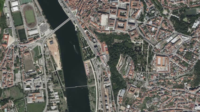 Zooming in and focusing on Coimbra, Portugal frome space - Perfect for Travel Intros and Backgrounds. Realistic 3D Animation.