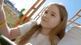 Dad and daughter go on thrill rides in an amusement park. Family outings and weekend fun. first person photography. uncomfortable and painful trailers on the slide - Powered by Shutterstock - Get 15% off with code: PIKWIZARD15
