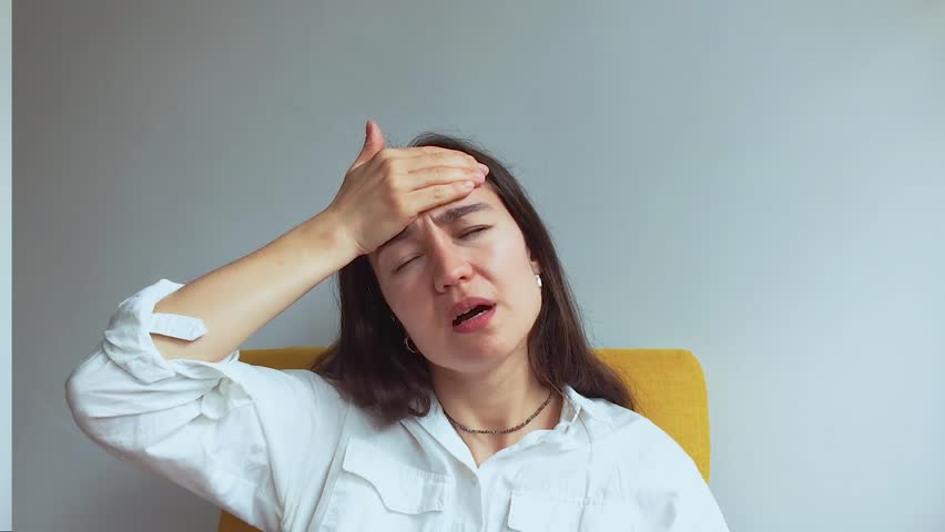  A young attractive girl suffers from a headache.