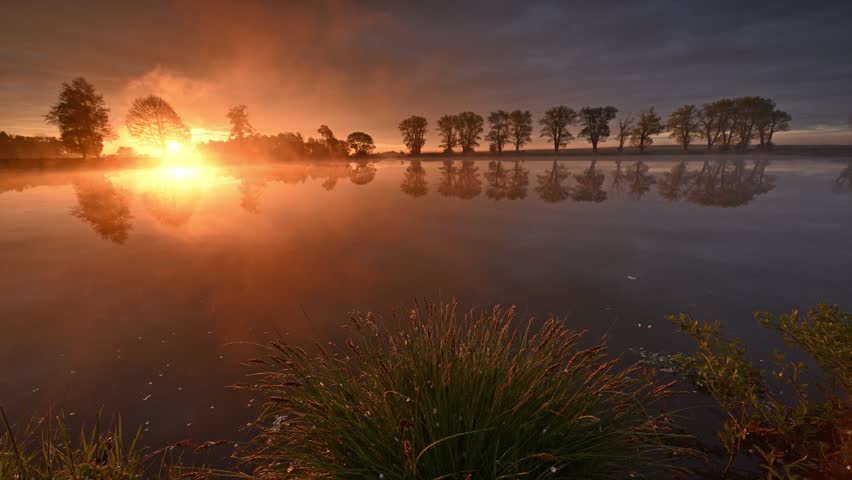 Colorful spring sunrise over the lake