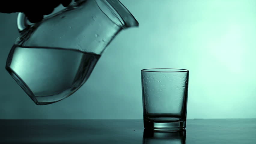 Drinking water is poured into a glass