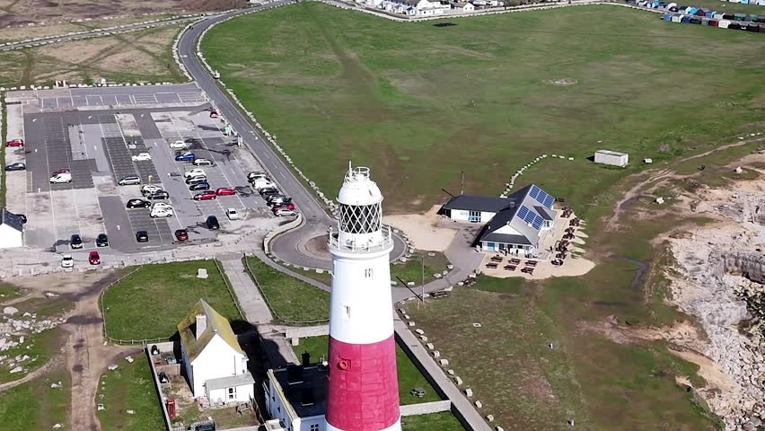 Discover the iconic Portland Bill Lighthouse in Dorset, a breathtaking coastal landmark surrounded by rugged cliffs and stunning seascapes. Perfect for capturing the essence of maritime heritage