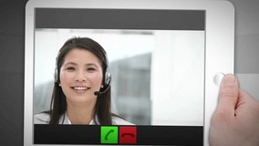 Montage of a tablet showing a call centre situation on grey background - Powered by Shutterstock - Get 15% off with code: PIKWIZARD15