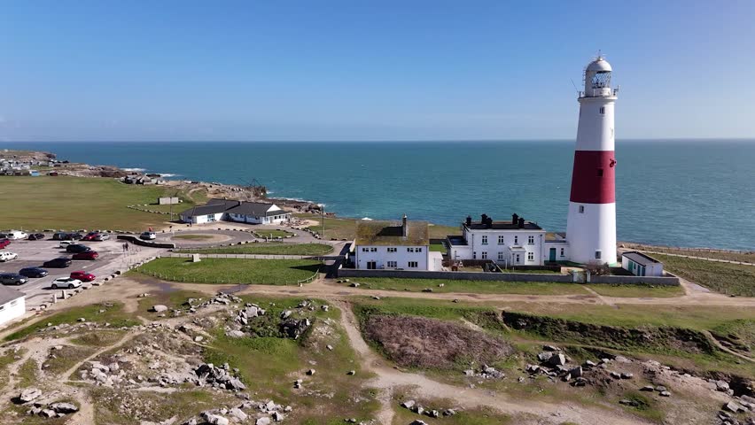 Discover the iconic Portland Bill Lighthouse in Dorset, a breathtaking coastal landmark surrounded by rugged cliffs and stunning seascapes. Perfect for capturing the essence of maritime heritage