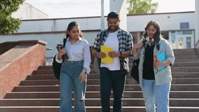 Young Indian students chatting with each other after class walking outside - Powered by Shutterstock - Get 15% off with code: PIKWIZARD15
