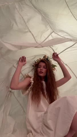 Woman Wearing Flower Crown Inside Tent