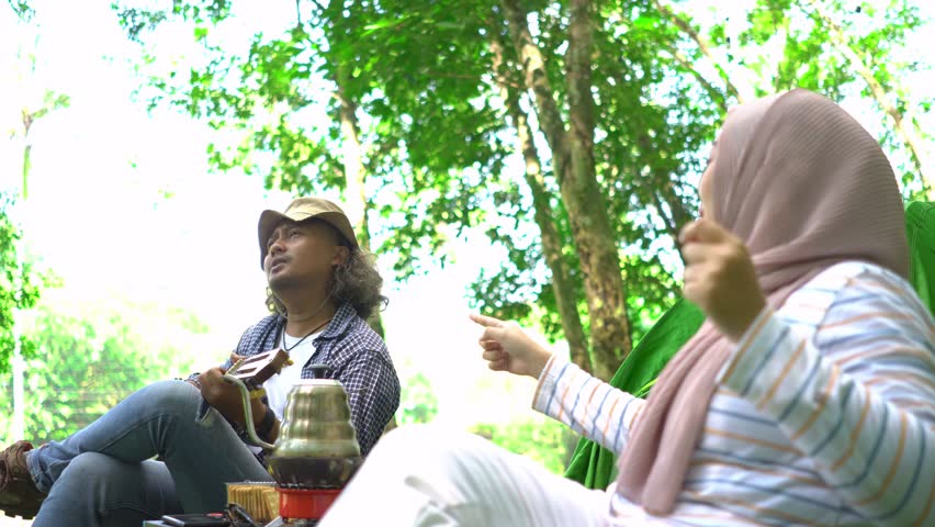 Happy family Asian man or father playing guitar while his daughter singing song together outdoors at home, Activity family, Enjoying lifestyle senior 