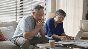 Stressed husband,asian mature retired calculate budget from invoice.Finance,Debt,insurance,money,calculator Debt bills and budget with an old asian couple in home for retirement or pension planning. - Powered by Shutterstock - Get 15% off with code: PIKWIZARD15