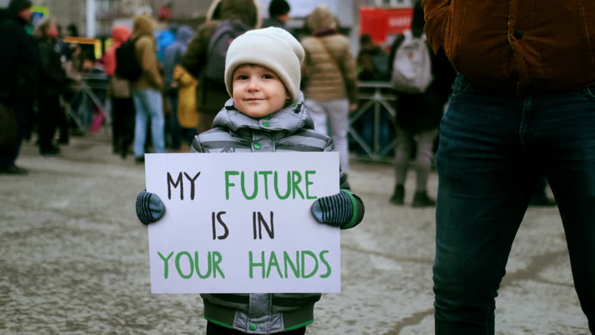 My future your hands protest banner. Cute little activist boy hold eco placard. Gen z kid demonstration. Child protester picket city street. Adult people responsible. Childhood concept Climate problem