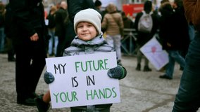 My future your hands protest banner. Cute little activist boy hold eco placard. Gen z kid demonstration. Child protester picket city street. Adult people responsible. Childhood concept Climate problem - Powered by Shutterstock - Get 15% off with code: PIKWIZARD15