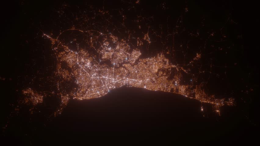 Santo Domingo (Dominican Republic) aerial view at night. Top view on city from space. Camera is zooming in, rotating clockwise