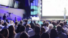 Large audience attentively listens to a keynote speaker at a business conference, exemplifying corporate learning and professional development. - Powered by Shutterstock - Get 15% off with code: PIKWIZARD15