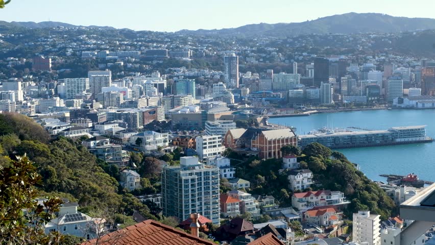 Aerial cityscape of Wellington city with offices, apartments and houses overlooking harbour in Wellington, New Zealand Aotearoa
