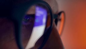 Eyes of Man in Glasses Looking at Computer Screen and Working Online on Program Development. Concentrated Eyesight of Serious Person Coding Internet Page. Macro Shot View of Moving Shining Projection - Powered by Shutterstock - Get 15% off with code: PIKWIZARD15