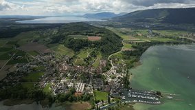 St. Peterinsel Switzerland aerial high and wide with sun spotlighting the village - Powered by Shutterstock - Get 15% off with code: PIKWIZARD15