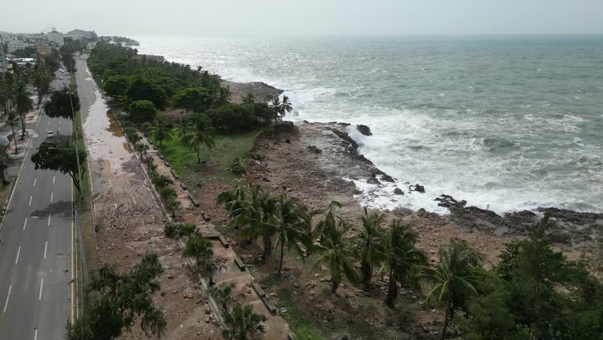 Waterfront Malecon coastal promenade of Santo Domingo and waves crashing, Dominican Republic. Aerial drone view