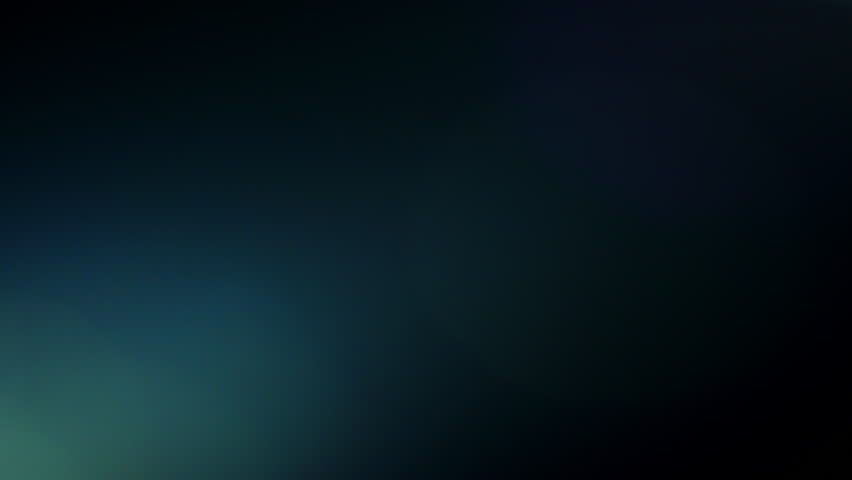 Soft blue lens flares gently illuminate a dark scene, creating a serene and captivating visual ambiance