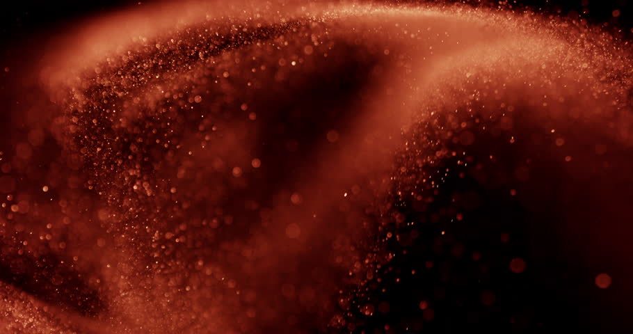 The mesmerizing flow of sand particles with sparkling bokeh, creating a captivating and tranquil visual display