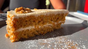Tasty slice of carrot cake with a walnut on a plate, sweet dessert, 4K shot - Powered by Shutterstock - Get 15% off with code: PIKWIZARD15