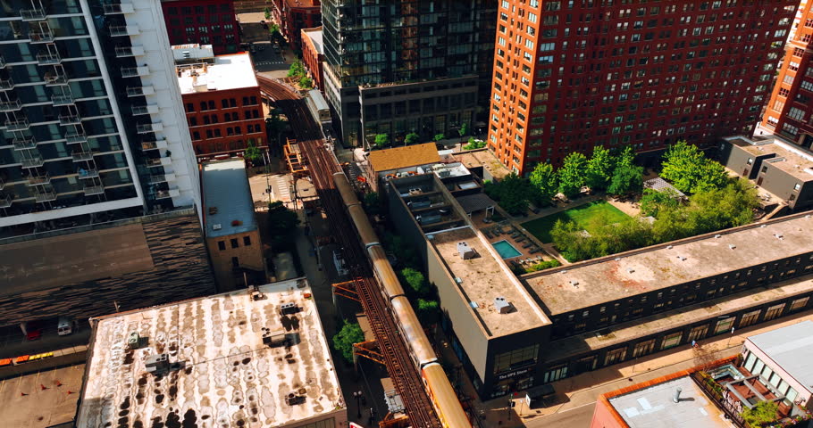 View on the train going by the city. Top perspective on the Chicago neighborhood at daytime.