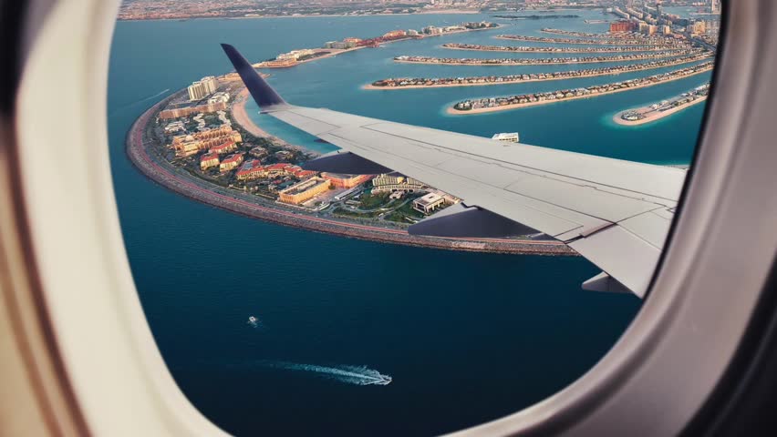 
Aerial view of the Palm Jumeirah
Island in Dubai, United Arab Emirates, aerial view of Dubai through an airplane window