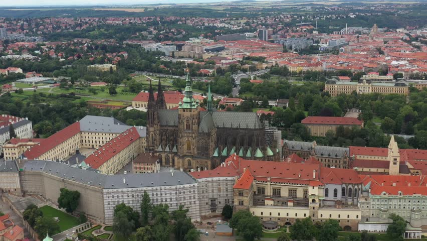 Prague Old Town with St. Vitus Cathedral and Prague castle complex with buildings revealing architecture from Roman style to Gothic 20th century. Prague, capital city of the Czech Republic. Drone, 4k.